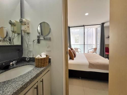 Postel nebo postele na pokoji v ubytování Amoblados Casa de Pinos Bucaramanga