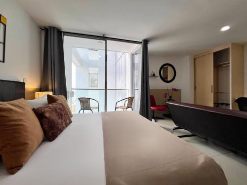 Postel nebo postele na pokoji v ubytování Amoblados Casa de Pinos Bucaramanga