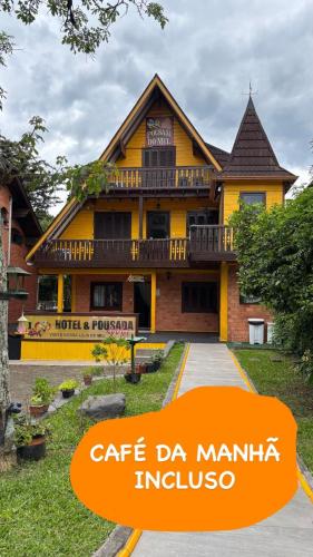 a building with the text cafe da manilla indonesia at Hotel Pousada do Mel in Gramado