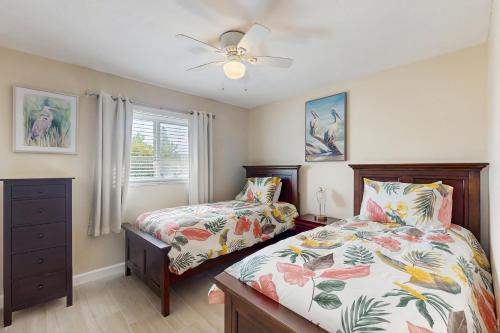 Postel nebo postele na pokoji v ubytování Mango House