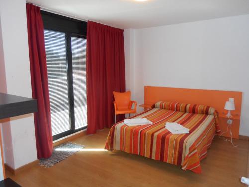 Postel nebo postele na pokoji v ubytování Apartamentos Bahía de Boó