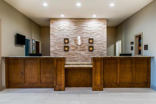 a lobby with a reception desk in a building at Comfort Inn & Suites Valdosta I-75 in Valdosta