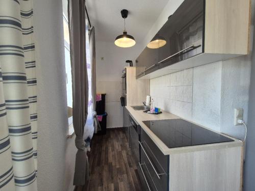 Kuchyň nebo kuchyňský kout v ubytování Mikra Homes24 in Meerane