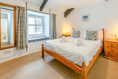 a bedroom with a large bed and a window at 2 Bed in St. Ives oc-b31979 in St Ives