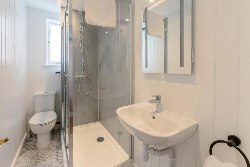a bathroom with a sink and a toilet and a shower at 2 Bed in St. Ives oc-b31979 in St Ives
