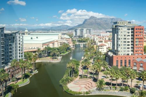 a view of a city with a river and buildings at Belina - Knightsbridge Prestige Suite in Cape Town