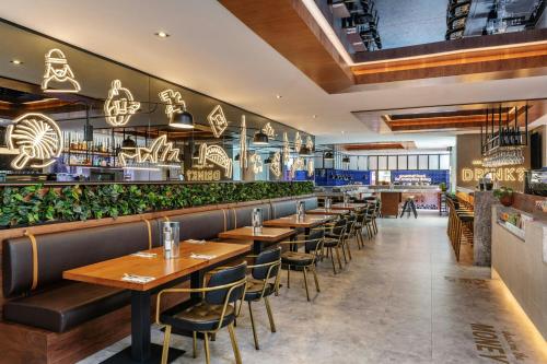 a row of tables and chairs in a restaurant at Sheraton The Walk, Dubai in Dubai