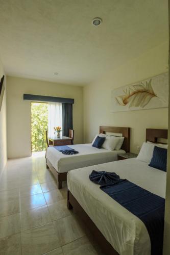 Llit o llits en una habitació de Hotel Rami