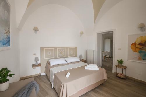 a bedroom with a large bed in a room at leuca house in Lecce