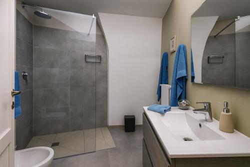 a bathroom with a shower and a sink at leuca house in Lecce