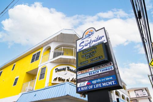 a sign for a restaurant in front of a yellow building at 70 Steps to Beach Dewey Beach in Dewey Beach
