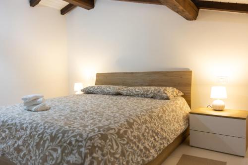 Ένα ή περισσότερα κρεβάτια σε δωμάτιο στο Dimora dei Venulei