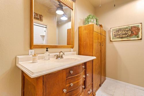 a bathroom with a sink and a mirror at Emerald Point, Lakefront with Gorgeous Views in McAlester