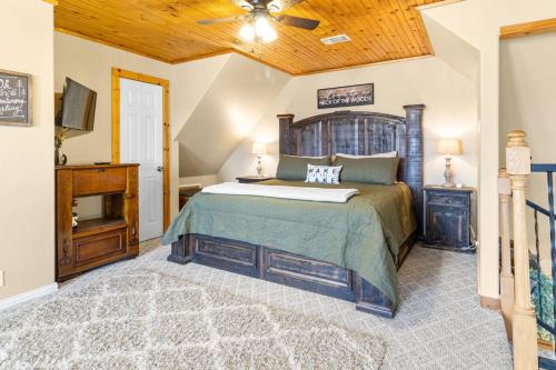 a bedroom with a bed and a wooden ceiling at Emerald Point, Lakefront with Gorgeous Views in McAlester