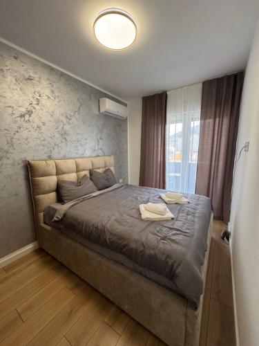 Giường trong phòng chung tại Apartman Obala