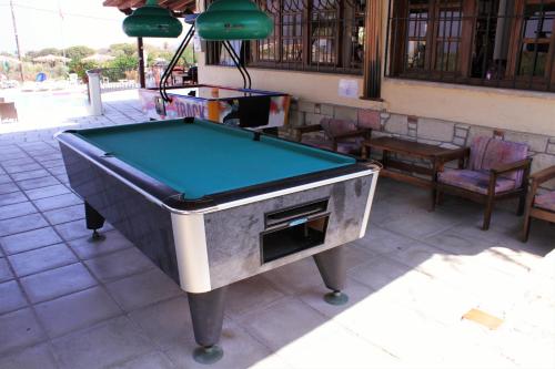 a pool table sitting on top of a patio at Ampavris Family Apartments in Kos Town
