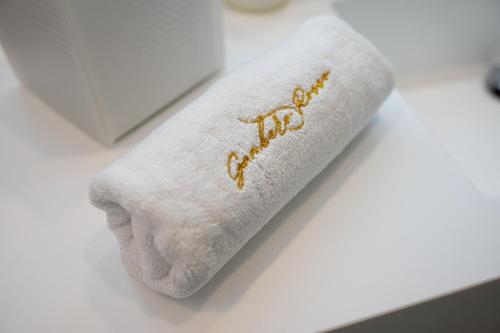 a white towel with the word spa written on it at boutique hotel gambero rosso in Marina di Gioiosa Ionica