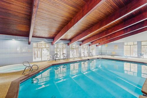a large indoor swimming pool in a building at Beaver Village in Winter Park
