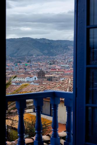 a view of a city from a balcony at 7 Toritos Hotel Boutique by Hacienda in Cusco