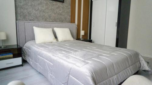 Postel nebo postele na pokoji v ubytování Bella Apartment