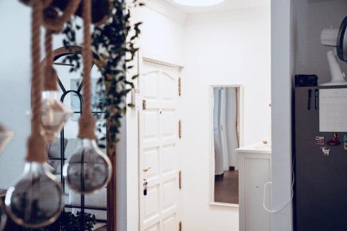 a kitchen with a white door and a refrigerator at Casa Oceanchild - Terraza con Vista Mar, Morro Jable in Morro del Jable