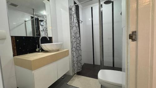 a bathroom with a sink and a toilet and a shower at Amazon Condo, Building B, ground floor with direct pool access in Jomtien Beach