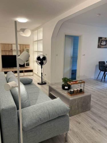 a living room with a couch and a table at Treviet in Pirna