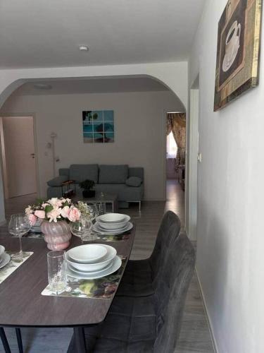 a living room with a table with plates on it at Treviet in Pirna