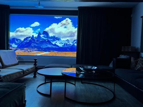 a living room with a large window with a mountain view at Rest & Relax Doubice in Doubice