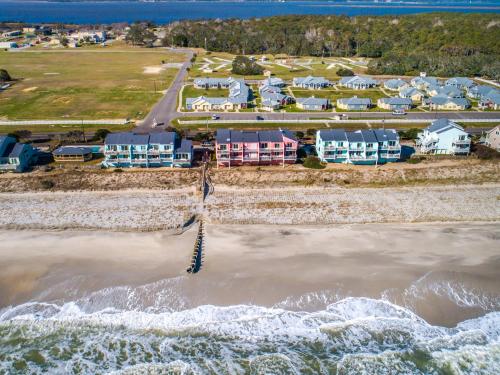 an aerial view of a beach with houses and the ocean at Ocean Dunes 306 in Kure Beach