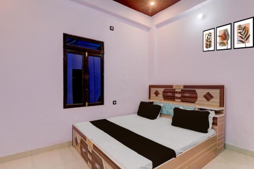 Una cama o camas en una habitación de Hotel O N P Grand and Resort