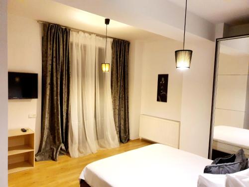 En eller flere senge i et værelse på Băneasa apartment