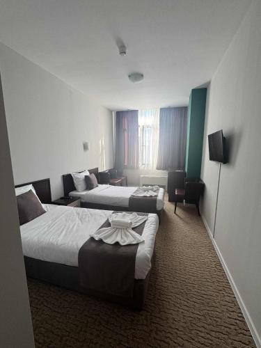 En eller flere senge i et værelse på Мотел КОМПЛЕКС GRILL and CHILL