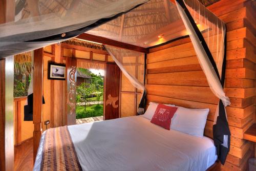 Tempat tidur dalam kamar di Mandala Eco Villas