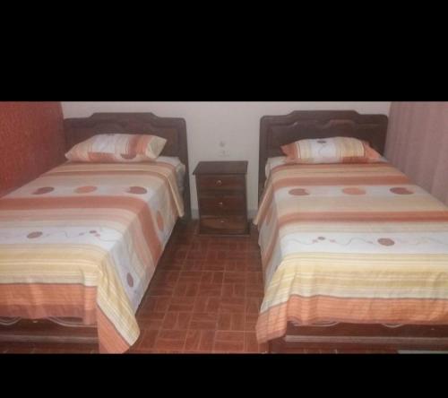Una cama o camas en una habitación de Hostal FINI