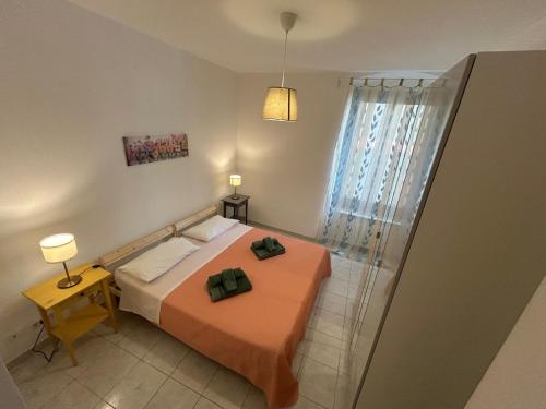 a bedroom with a bed and a glass shower at Il nido di Fra&Gab in Genova