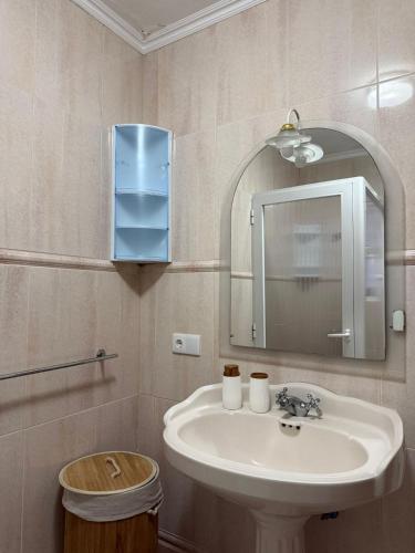 a bathroom with a sink and a mirror at Casa da Boa Ventura in Vila Franca do Campo