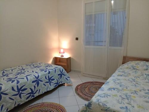 Ένα ή περισσότερα κρεβάτια σε δωμάτιο στο Appartement Spacieux et Lumineux à Tilila