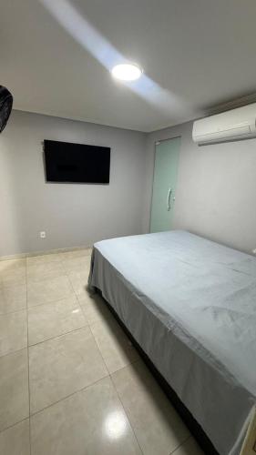 Ένα ή περισσότερα κρεβάτια σε δωμάτιο στο Refúgio dos Anjos