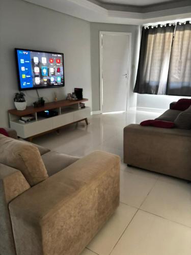 TV a/nebo společenská místnost v ubytování Casa ampla, lugar tranquilo