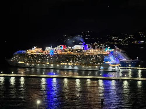 a cruise ship in the water at night at Excellent 2-Bedroom Condo in Gated Community in Philipsburg