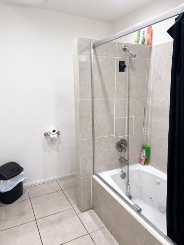 a bathroom with a shower and a bath tub at Soul in Los Angeles close to Downtown in Los Angeles