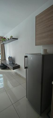 a kitchen with a stainless steel refrigerator in a room at NAT i-city smart house in Shah Alam