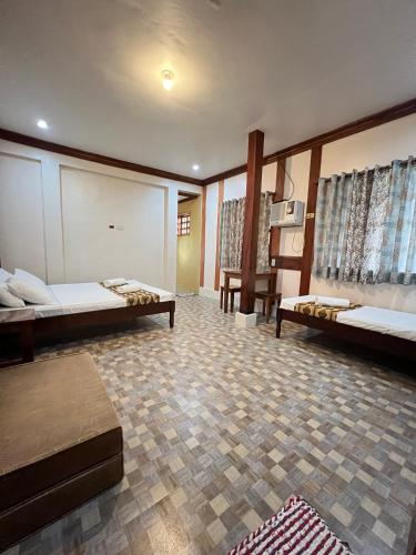 Ένα ή περισσότερα κρεβάτια σε δωμάτιο στο Sequor Palm Villa - Main Building