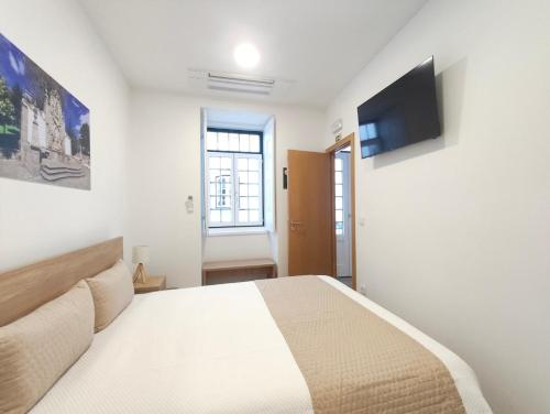 Et tv og/eller underholdning på Misericórdia Rooms