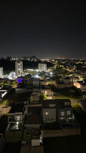 a view of a city at night with buildings at Apartamento campinas lado Puc 2 in Campinas