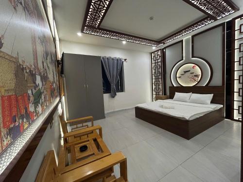 Un pat sau paturi într-o cameră la Khách sạn Phúc Đạt - Rạch Giá Phúc Đạt Hotel