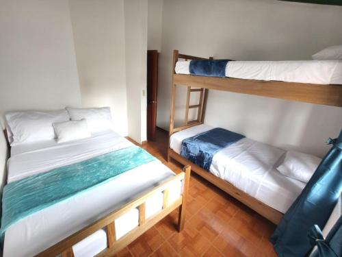 Roomiie Hostelにあるベッド