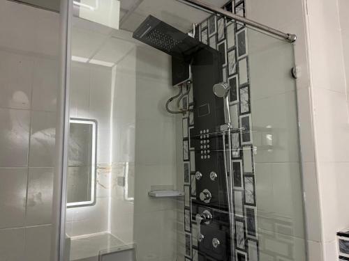 a shower with a glass door in a bathroom at View Talay 6 Pattaya in Pattaya