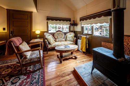 a living room with a couch and a table at McCarthy Lodge Resort in McCarthy